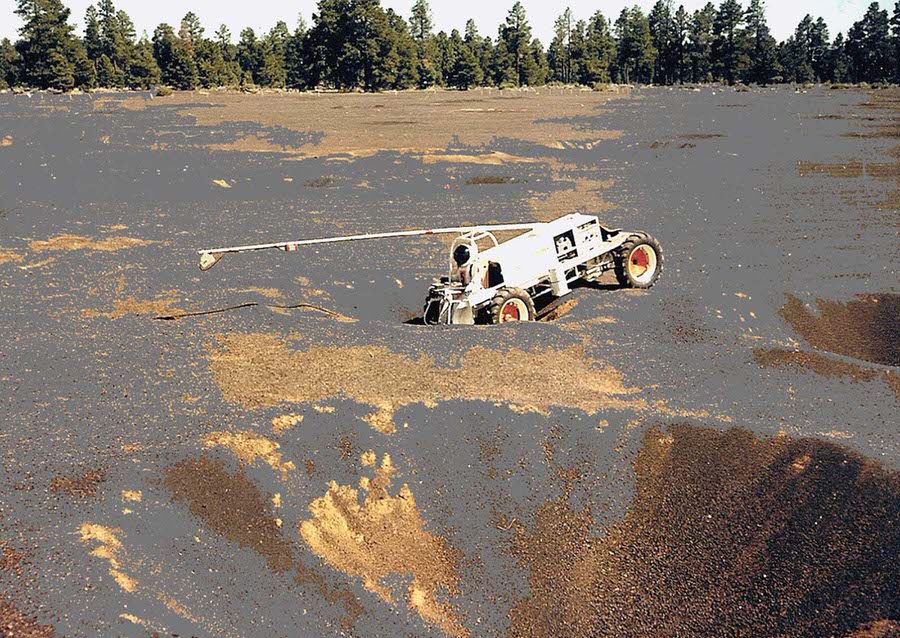 The Explorer vehicle negotiates a crater in the crater field.