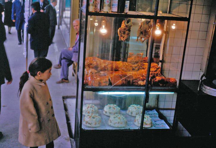 Cindy admiring roast lamb, chicken and pork at a psistaria in downtown Athens.