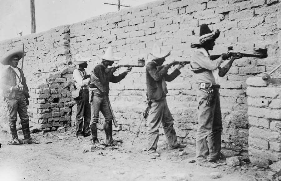 Rebels take aim from a fortified position in Ciudad Juarez.