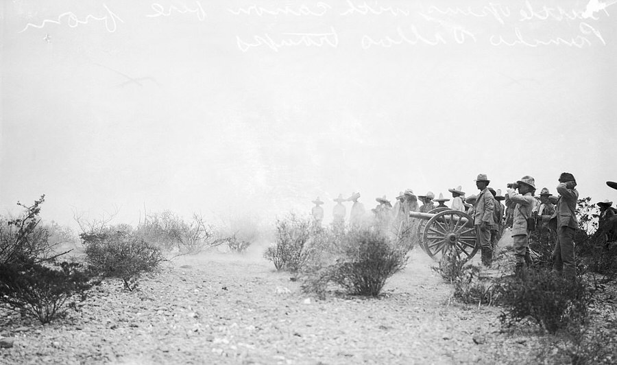 Fighting begins with cannon fire from Pancho Villa's troops.