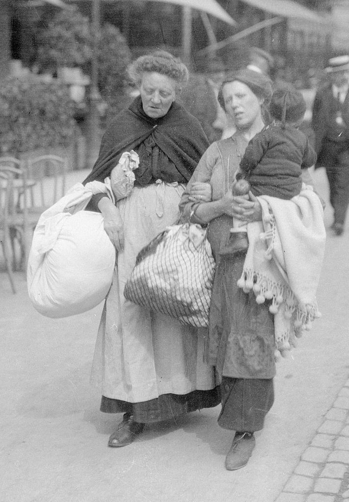 Three generations of refugees weary and footsore, they arrive in Brussels with such few belongings. September 19, 1914