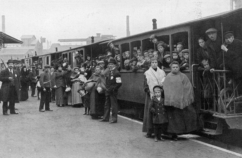 Belgian refugees crowding aboard a train headed for the coast after evacuating the city in front of advancing German troops during World War I.