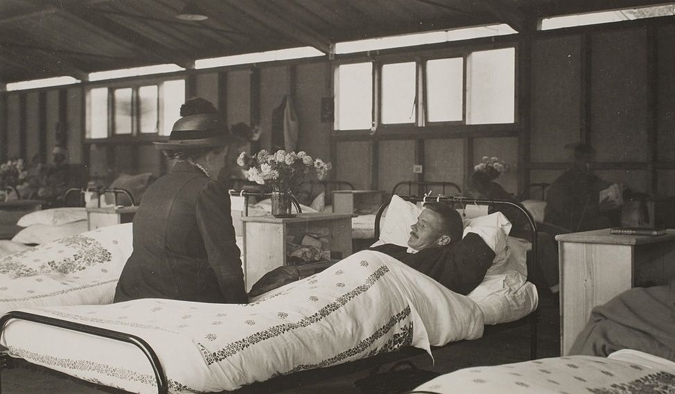 A Belgian refugee who has reached England finds her husband, a Belgian soldier, among the wounded in the British hospital, Cambridge, 1916.