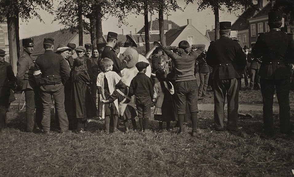 A kindly Dutch band entertaining Belgian refugees, 1916.