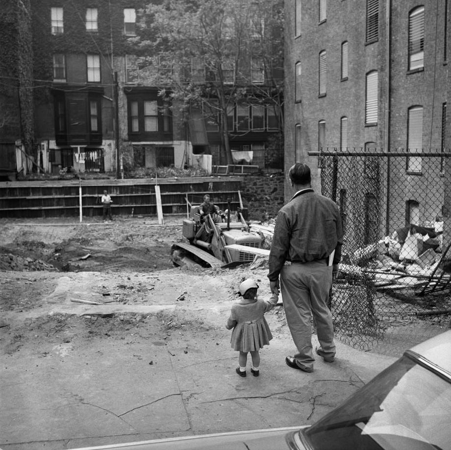 A father and daughter watch construction in Brooklyn Heights, March 1958.