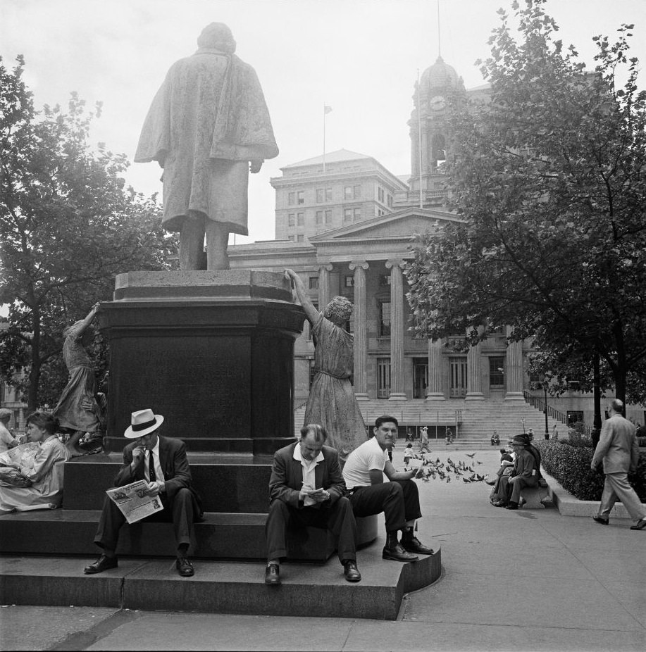 People linger behind the Henry Ward Beecher Monument, 1958.