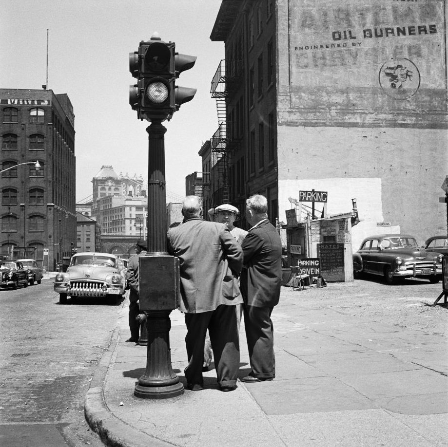 Men gather on a street corner in Brooklyn Heights, March 1958.