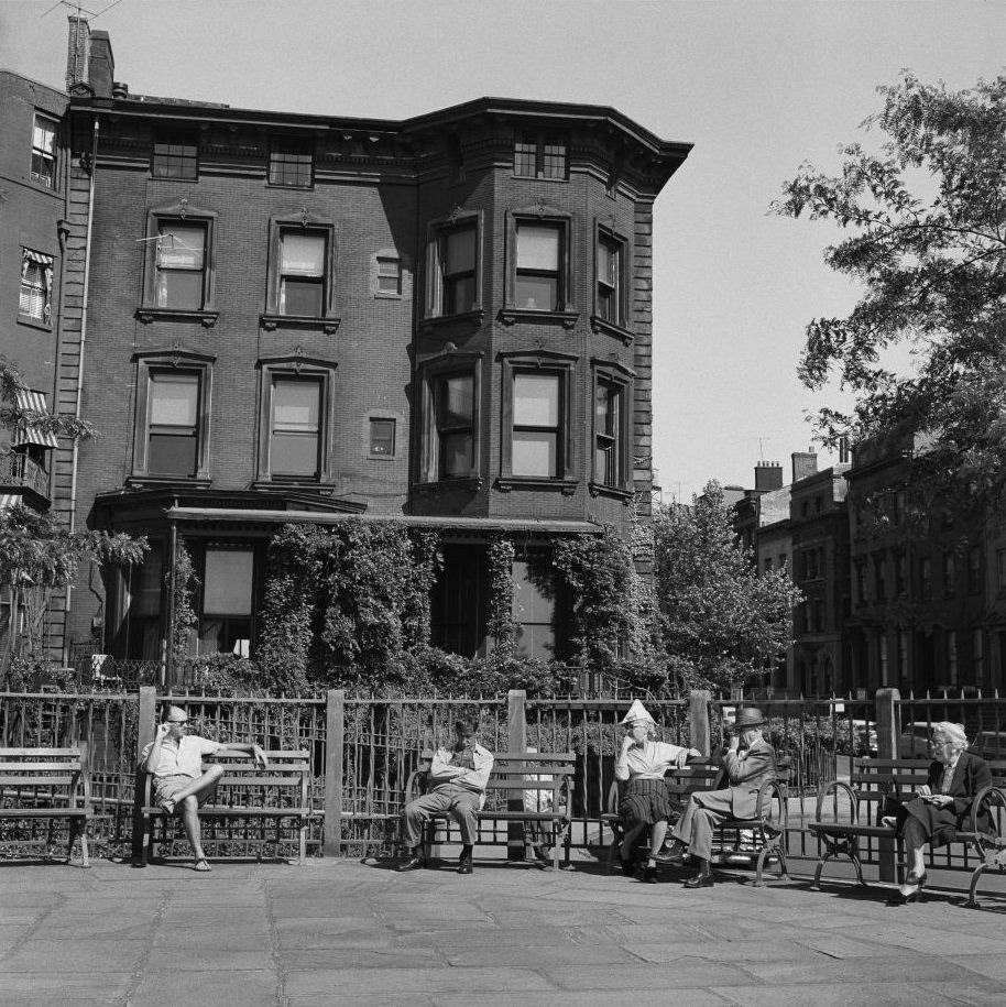 People sit on the Promenade in Brooklyn Heights, March 1958.