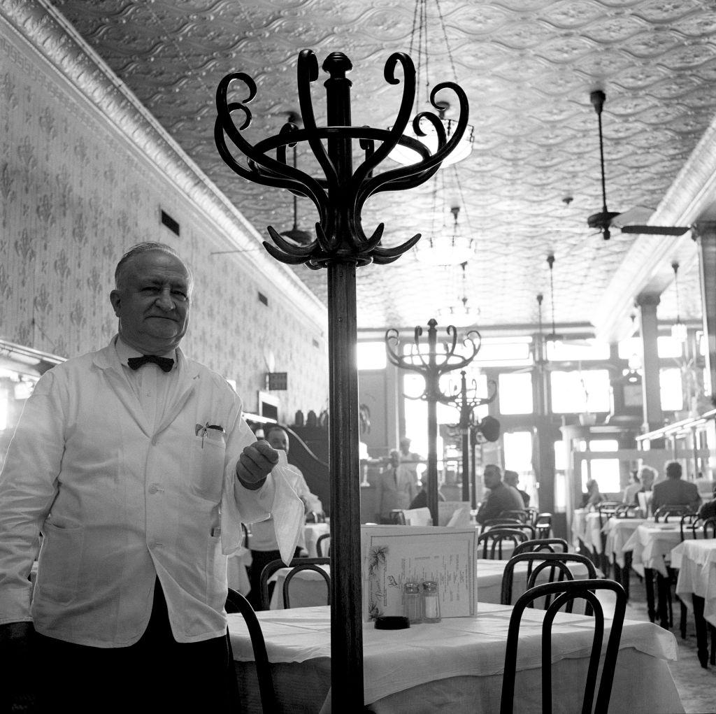 A waiter and customers at Joe's Restaurant on Fulton Street in Brooklyn Heights, March 1958.