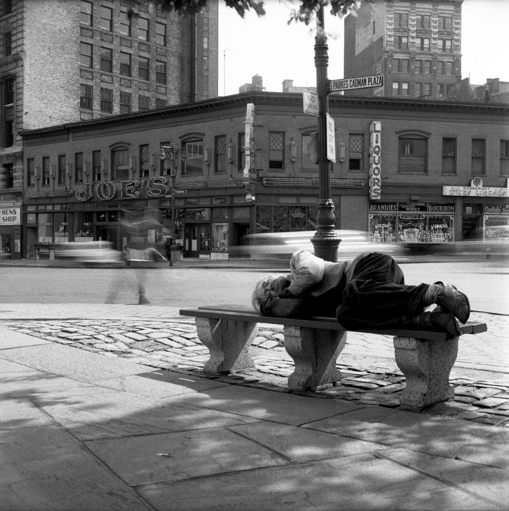 A homeless man sleeps in front of Joe's Restaurant on Fulton Street in Brooklyn Heights in March 1958.