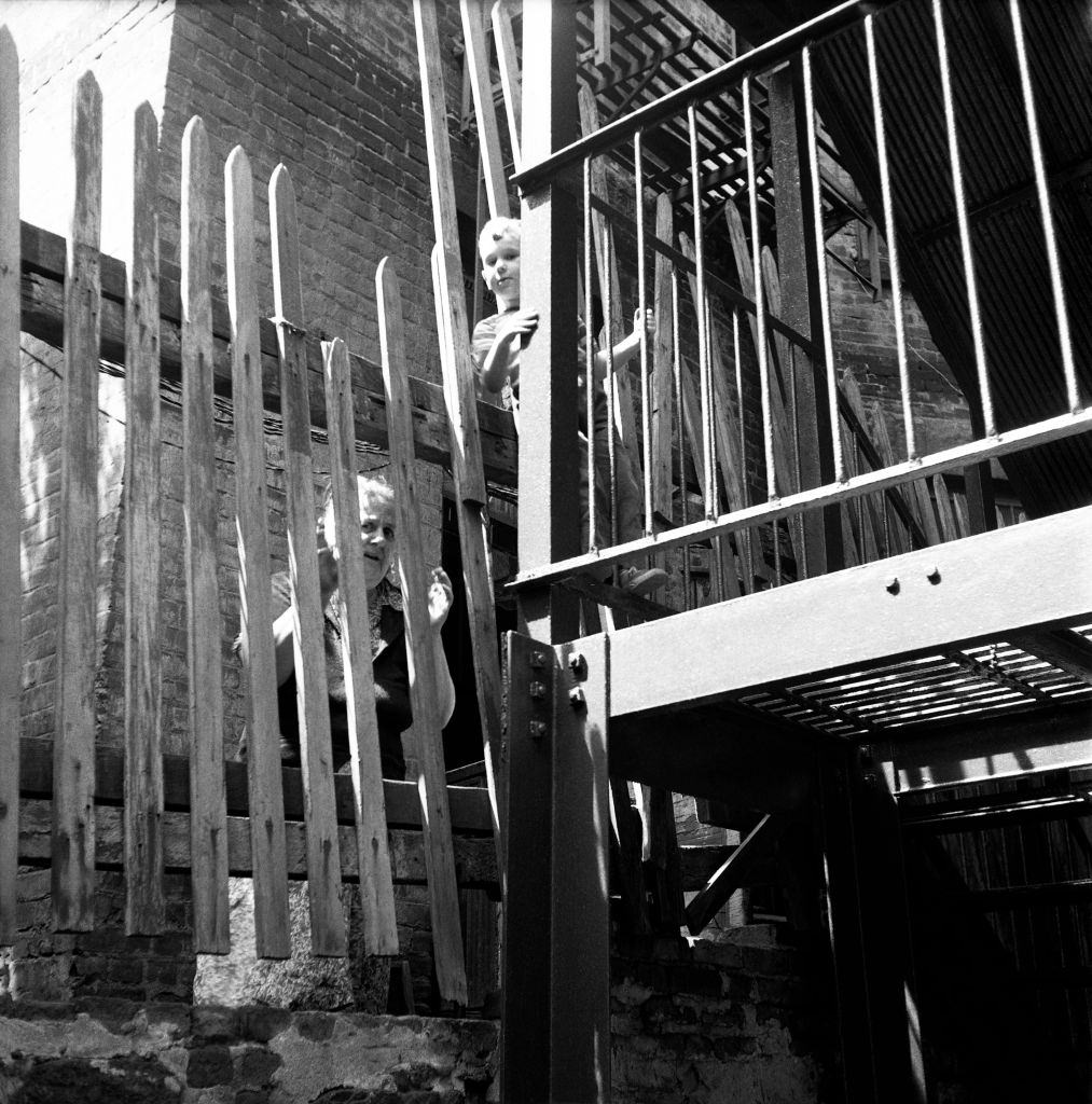 A mother and her son on a fire escape in Brooklyn Heights, March 1958.