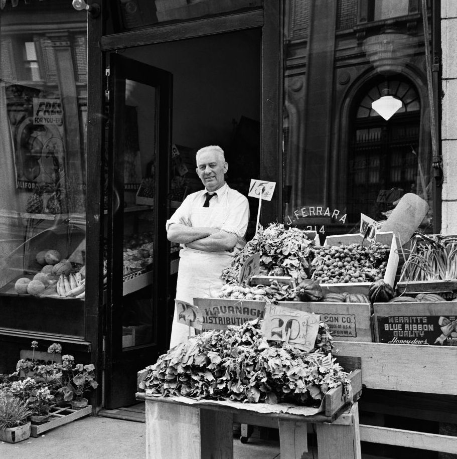A grocer at J. Ferrara Grocery in Brooklyn Heights, March 1958.