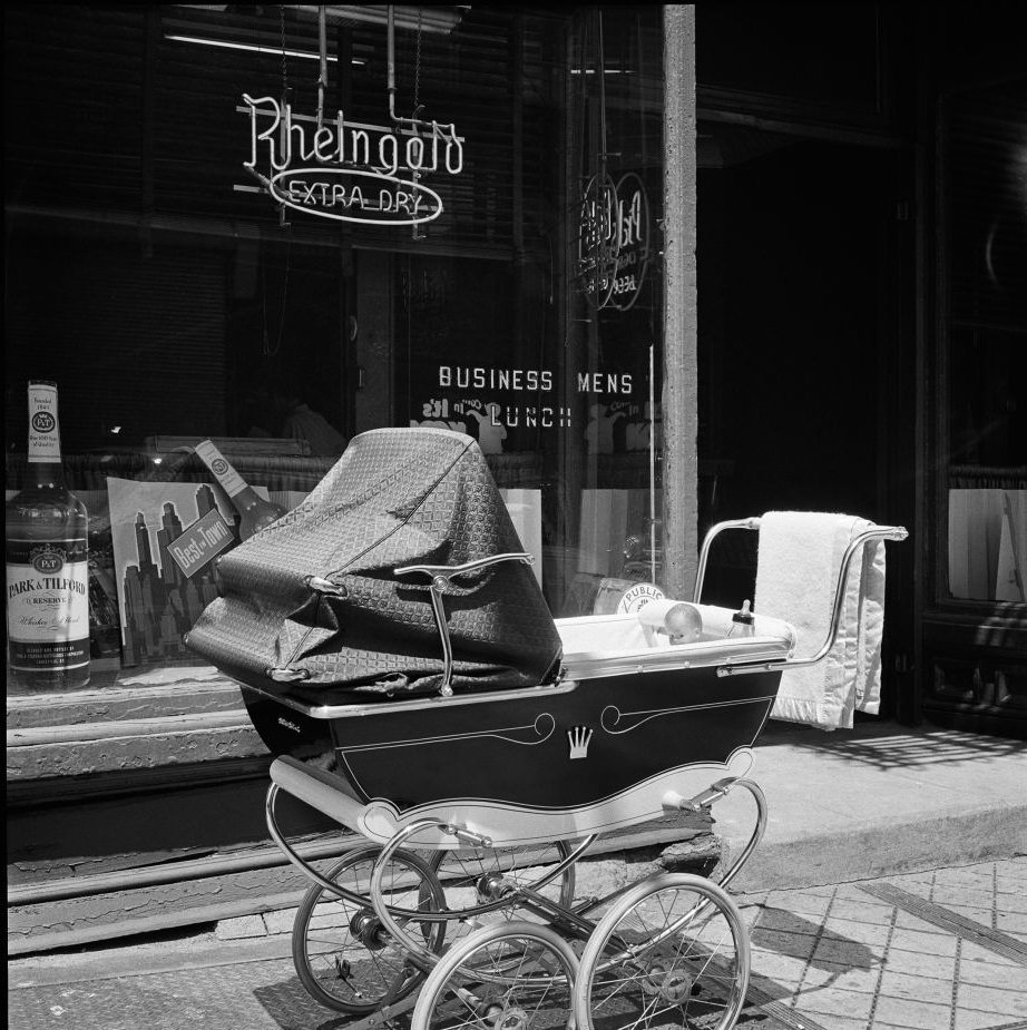 A baby carriage idles outside Kelly's Bar, at 13 Atlantic Avenue in Brooklyn Heights, March 1958.