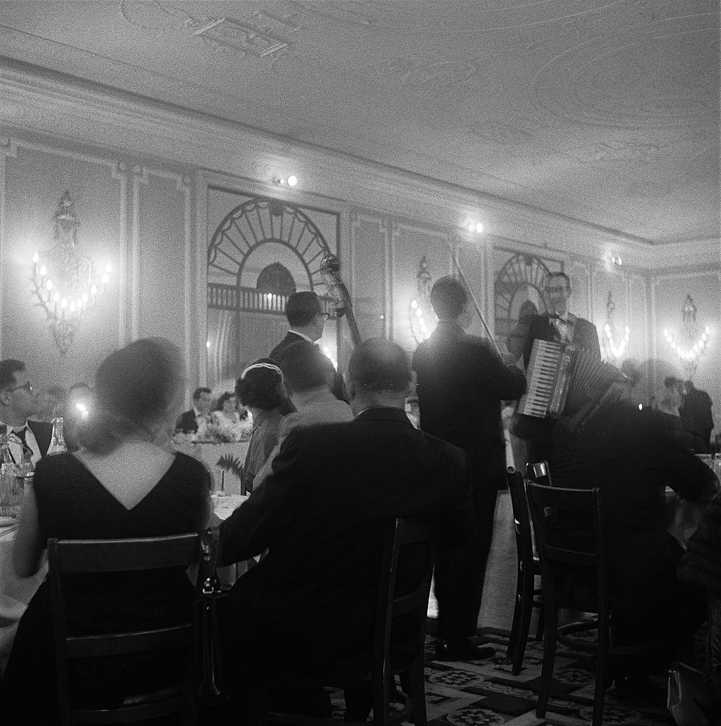 Guests at a wedding reception listen to the band in Brooklyn Heights, March 1958.