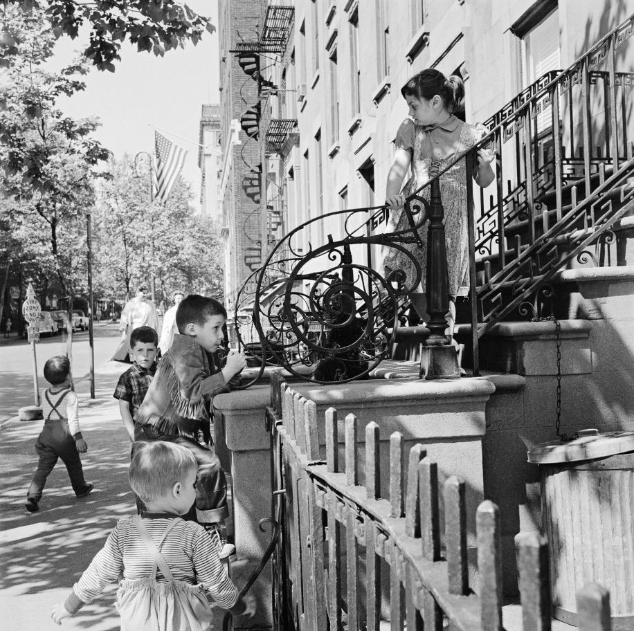 Children play on a stoop in Brooklyn Heights, March 1958.