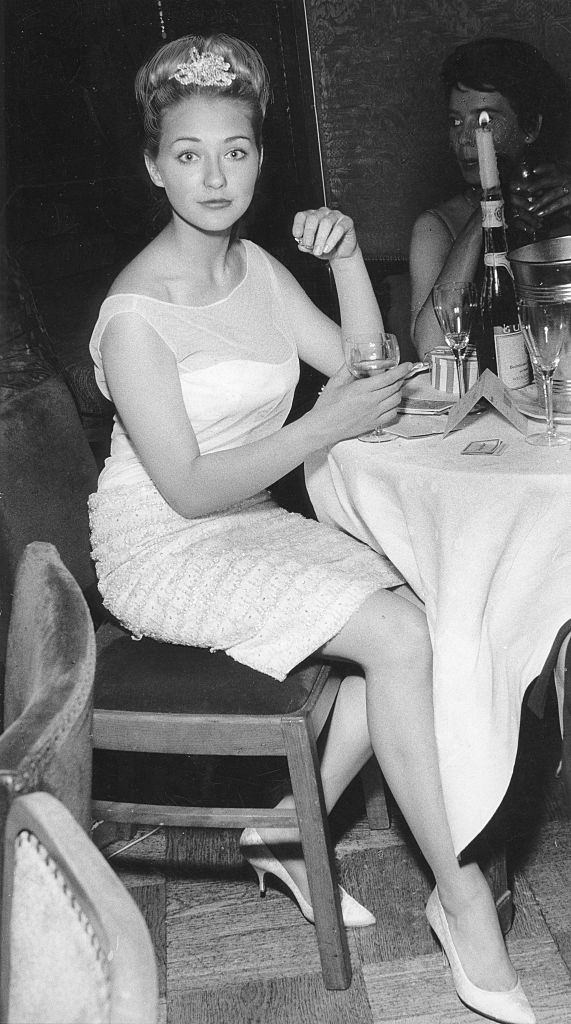 Christine Kaufmann enjoying the drink, 1960.