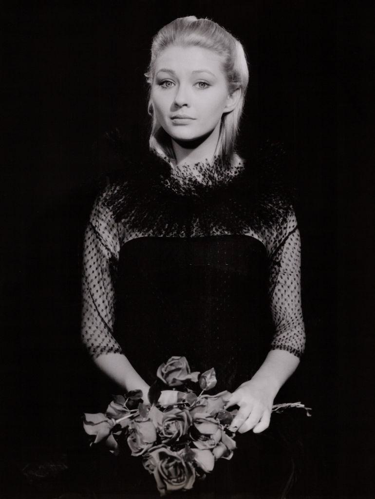 Christine Kaufmann holding a rose bouquet, 1951