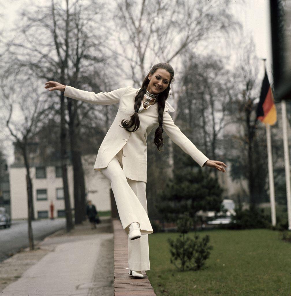Christine Kaufmann balancing on the wall, 1969.