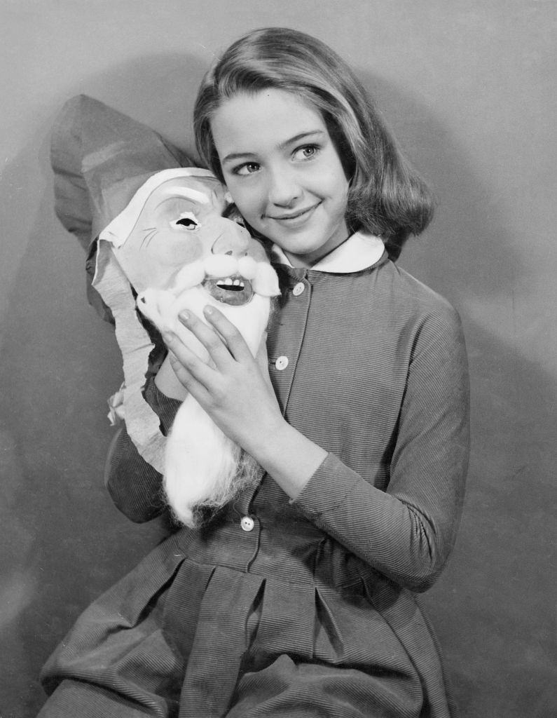 Christine Kaufmann as child with Santa Claus mask, 1955.
