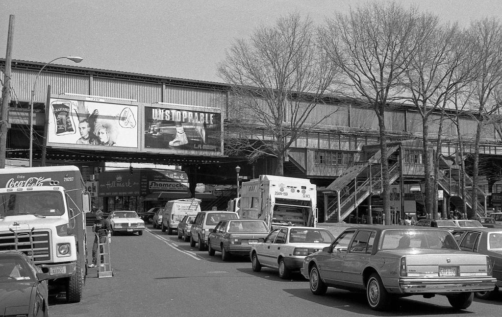 Looking north along National Street, towards the elevated subway line on Roosevelt Avenue, in the Corona neighborhood. Queens, New York, 1990.