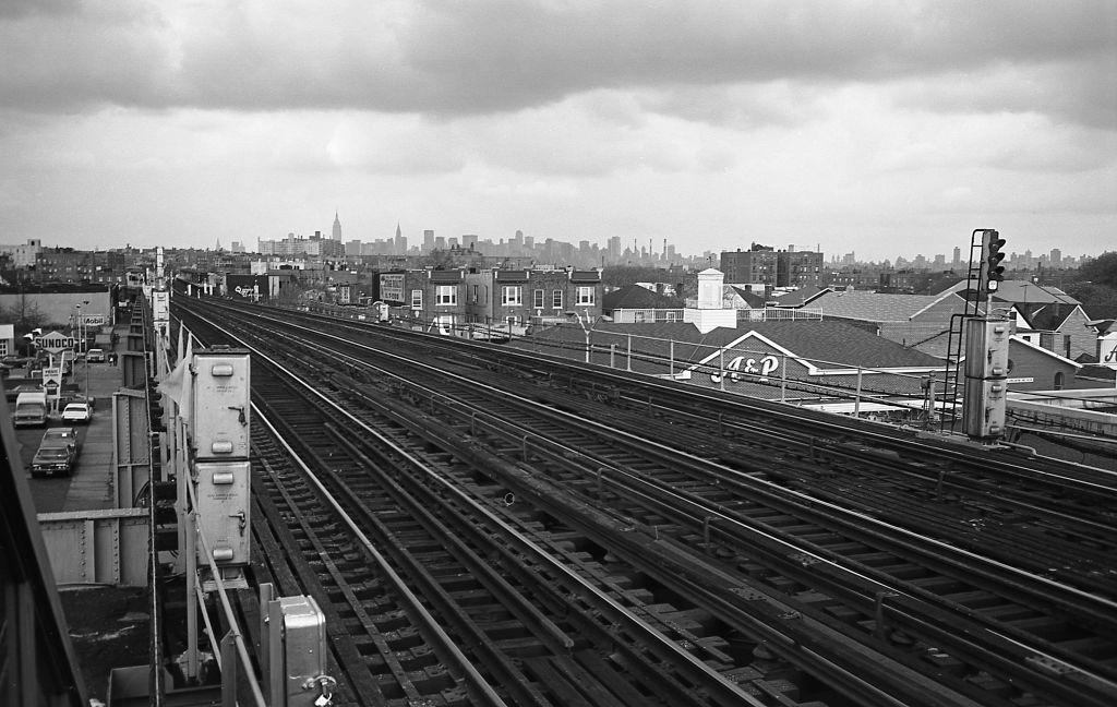 New York City Skyline and surrounding cityscape from the elevated subway platform at 103rd Street in Corona, Queens, 1974.