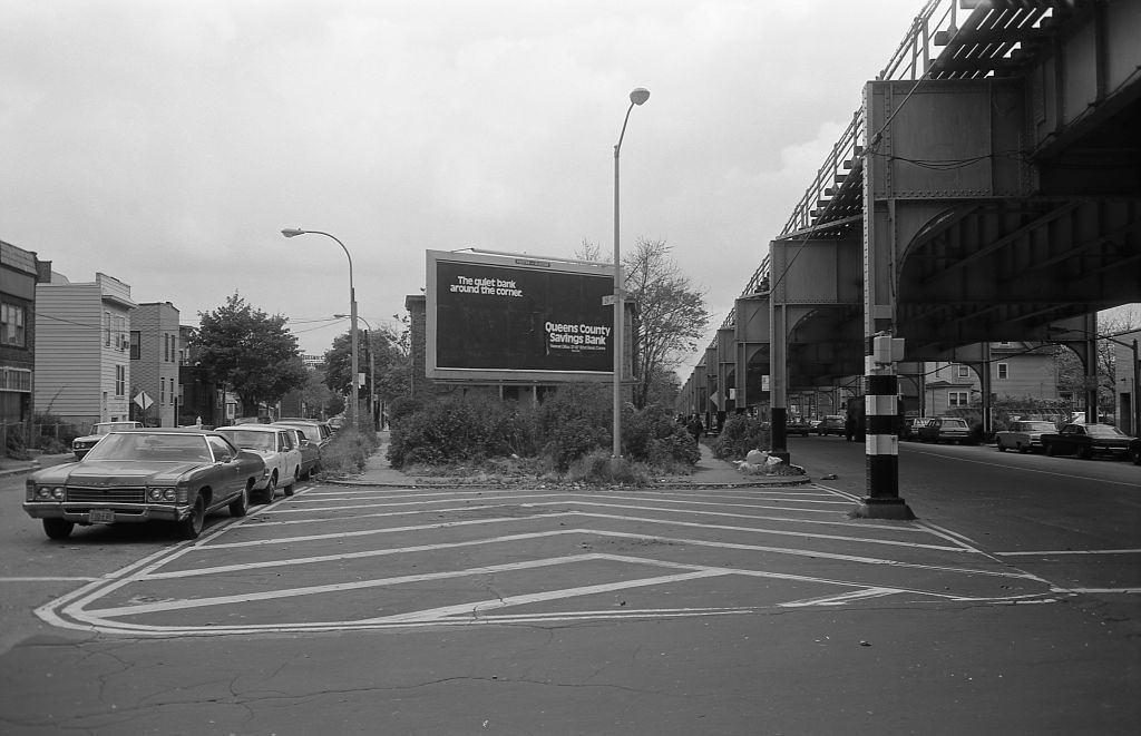 Residential homes next to the elevated subway line at 39th Avenue in Corona, Queens, 1974.