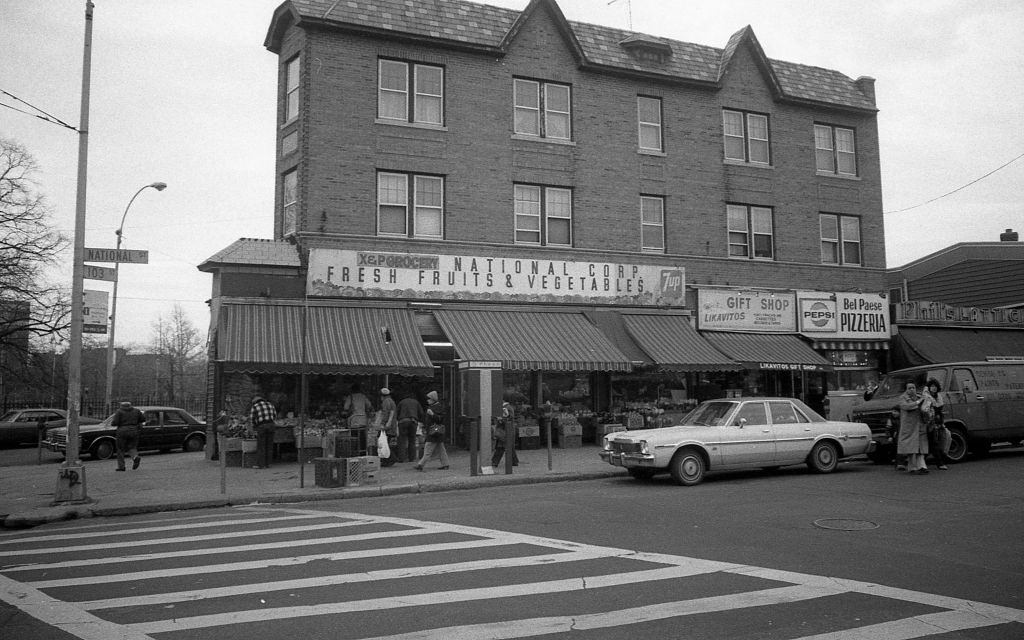 Intersection of 103rd and National streets, of various businesses along National Street, in the Corona . Queens, New York, 1982.