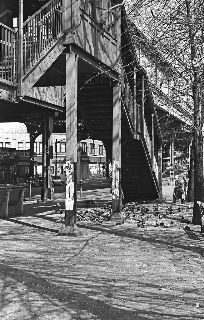 Stairs leading to the elevated subway line on Roosevelt Avenue in Corona. Queens, New York, 1982.