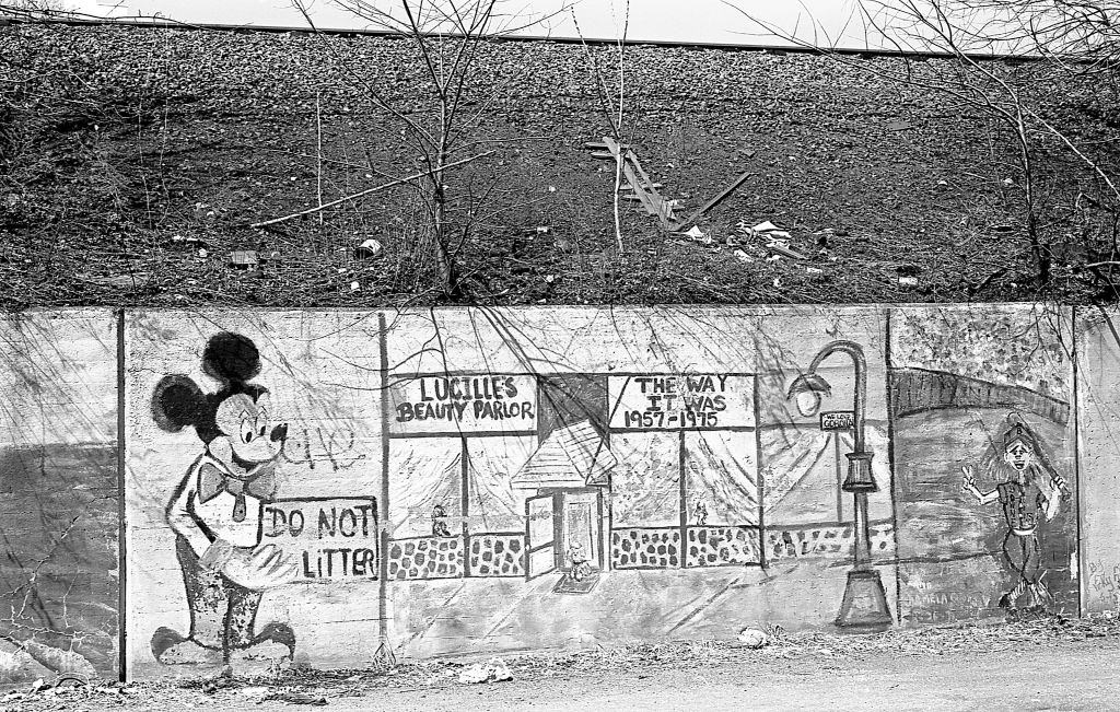 Graffiti on a retaining wall along 45th Avenue. Queens, New York, 1982.