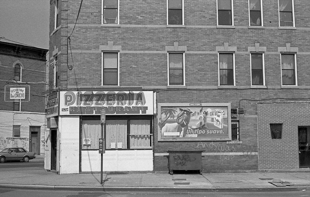 La Cantina De Don Chicho Pizzeria at the intersection of Junction Boulevard and Corona Avenue. Queens, New York, 1982.