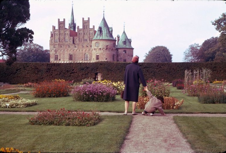 Mother and son in the park around Egeskov Castle, Funen Island, Denmark