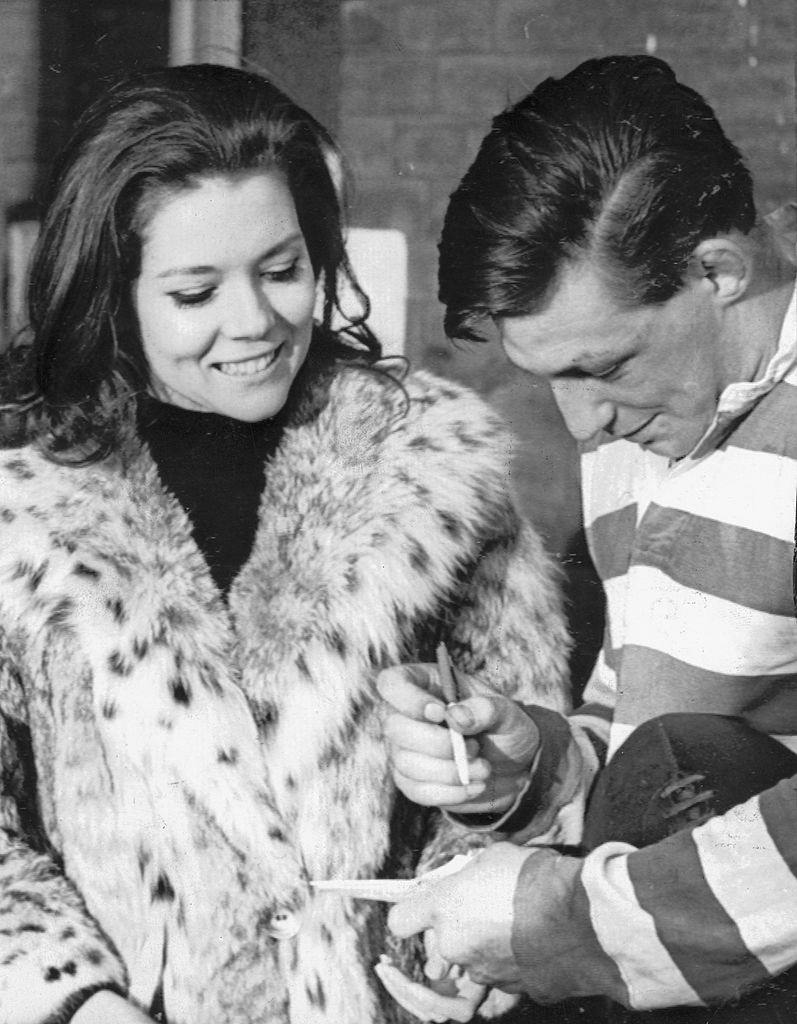 Diana Rigg at a rugby league match between Leeds and Oldham at Headingley, 1965.