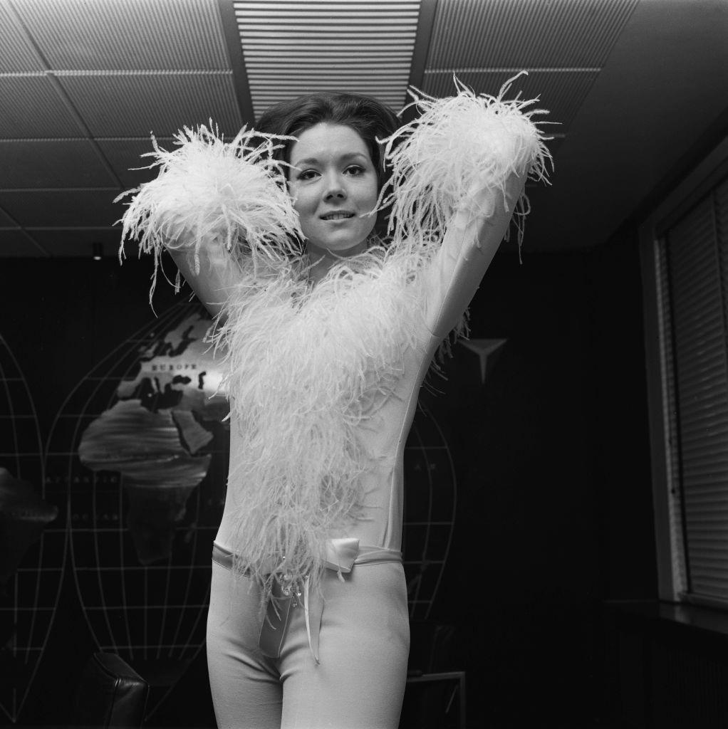 Diana Rigg modelling her outfit for her appearance on 'The Eamonn Andrews Show', UK, 3rd December 1965.