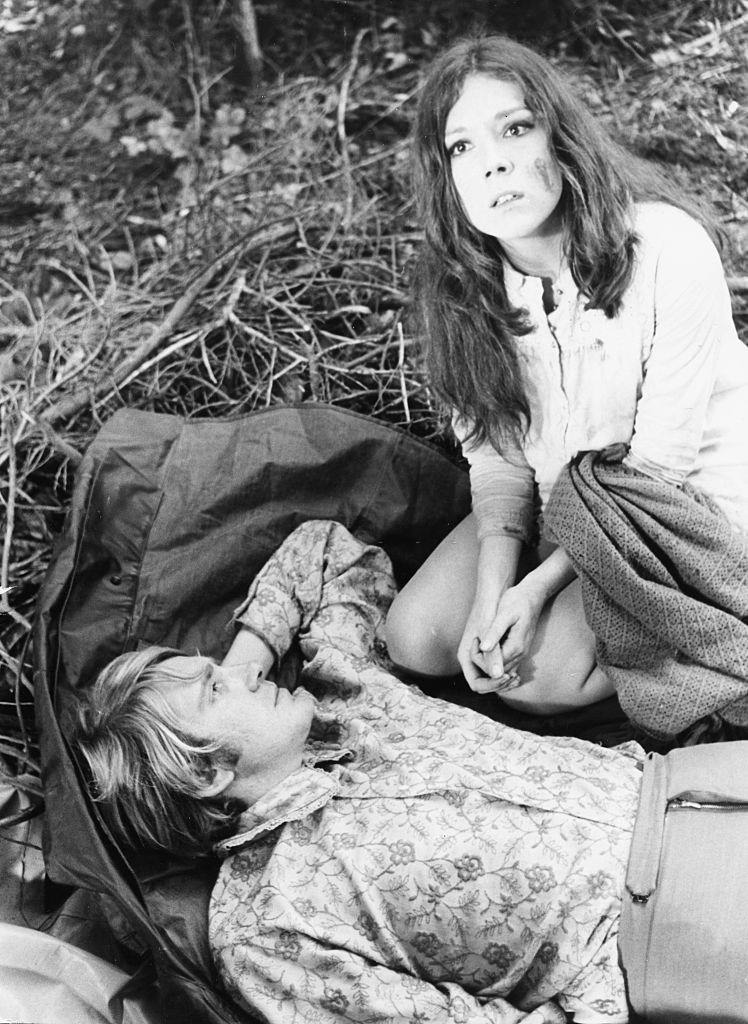 Diana Rigg with David Warner in the grounds of Compton Verney, on location filming 'A Midsummer Nights Dream', 1967.