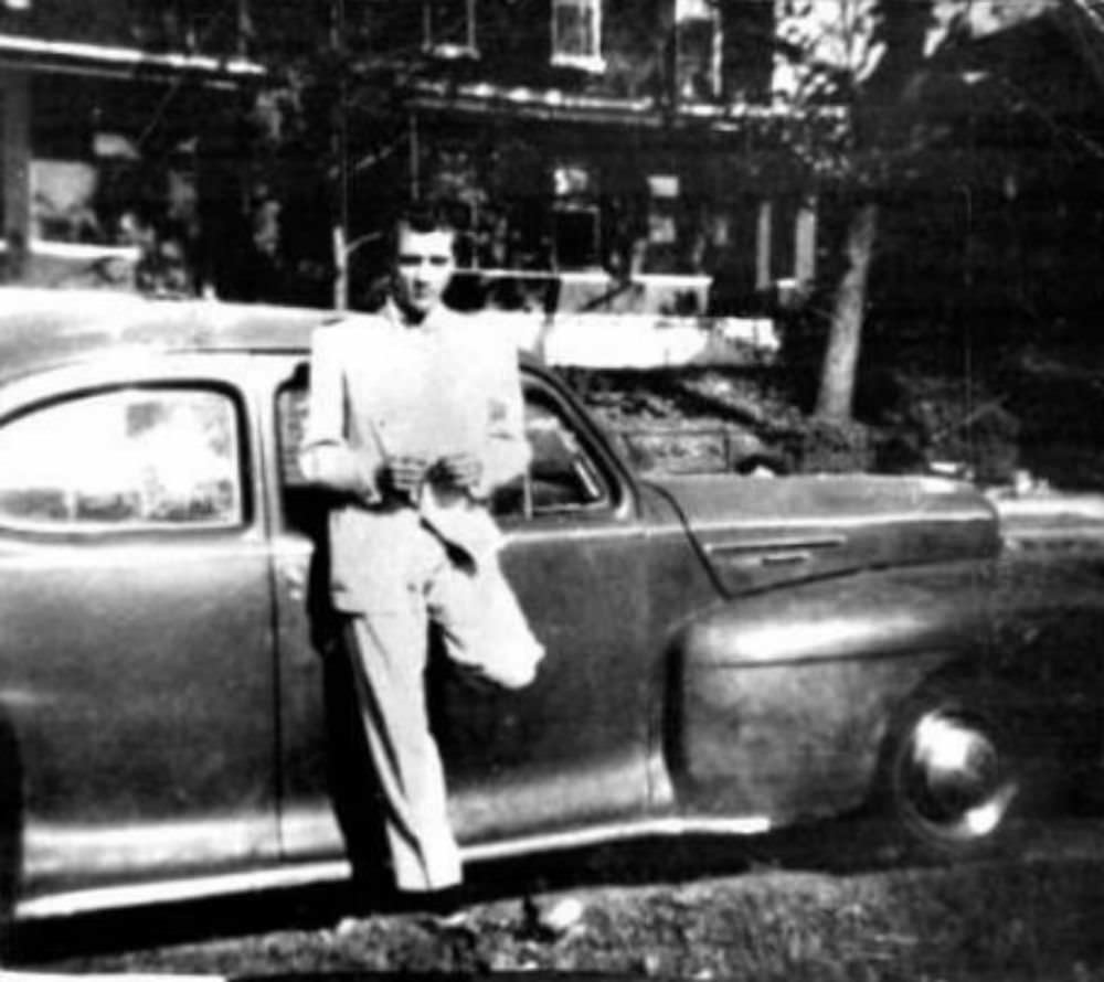 Elvis with his first car, 1942 Lincoln Zephyr Coupe, the photo was taken in front of his home at 462 Alabama Avenue in Memphis.