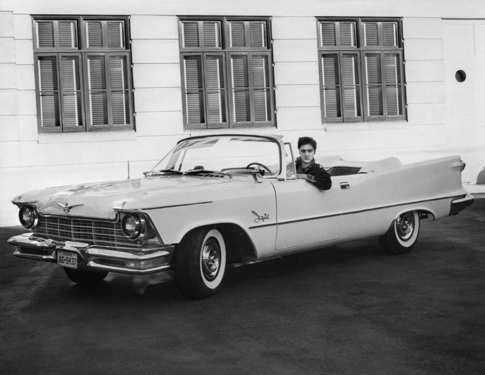Elvis in one of his pink Cadillacs.