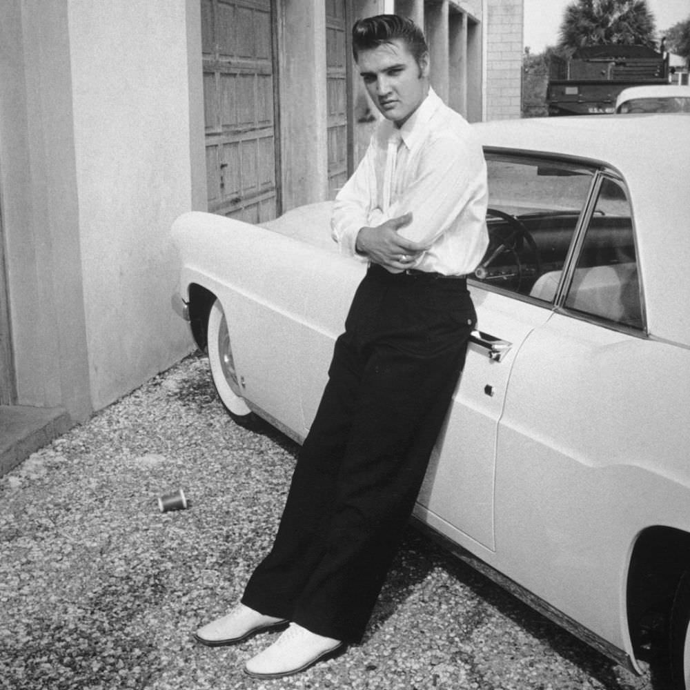 Elvis and his 1956 Lincoln Continental.