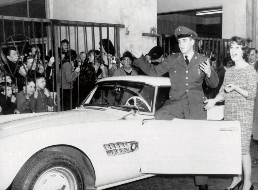 Elvis with his BMW 507 and local TV personality Uschi Siebert in Germany, 1958.