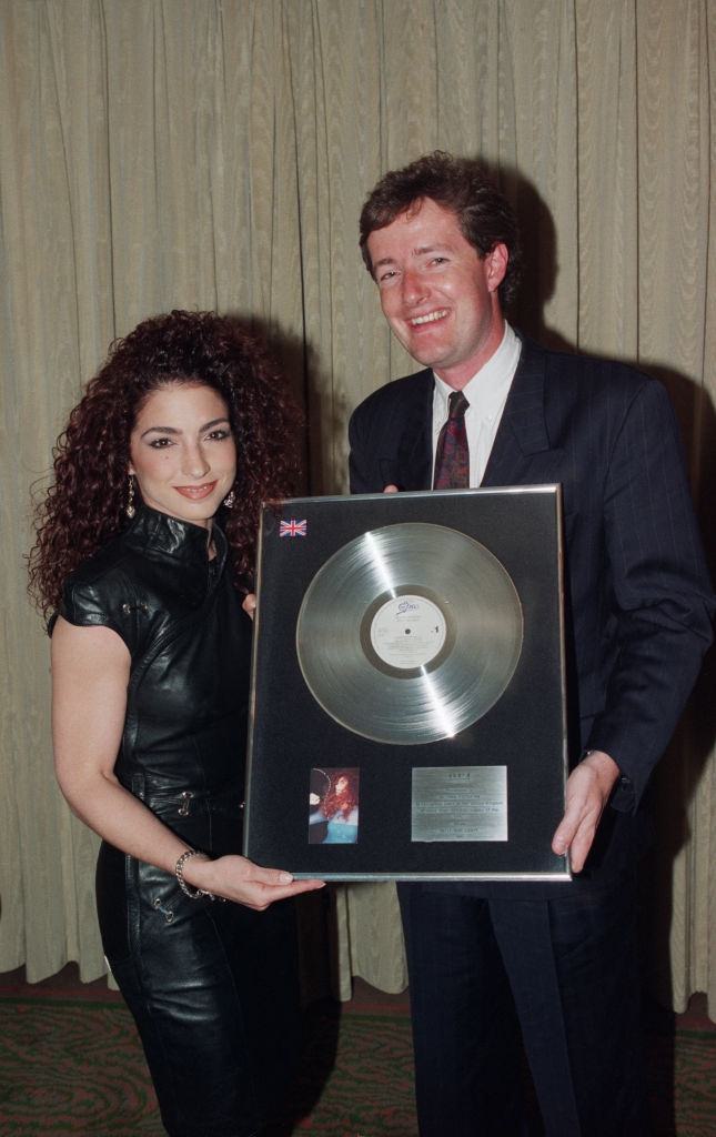 Gloria Estefan receives an award to recognise sales in the United Kingdom of more than 300,000 copies of her Epic album 'Into the Light', circa 1991.