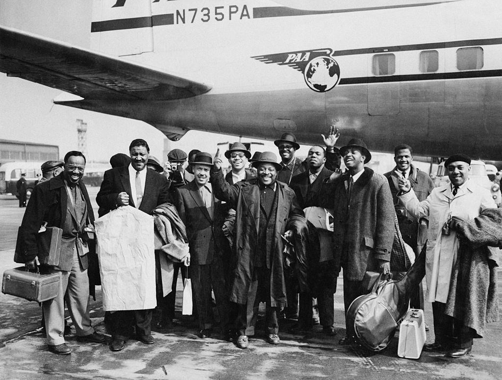 American jazz musician Count Basie nd his orchestra arrive at London Airport for a tour of Britain, 4th April 1957.