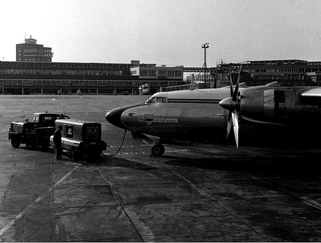 Servicing wagons prepare to pull away from the plane waiting on the tarmac. 9th June 1955.