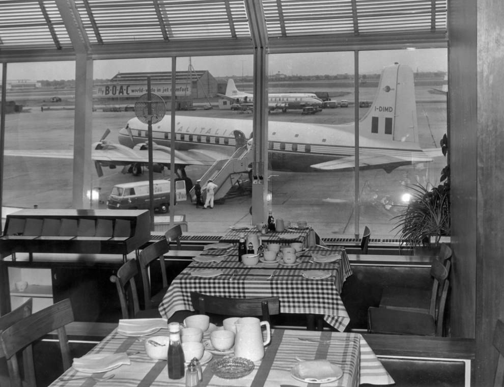 Airside, restaurant seating area overlooking apron, 1950s.