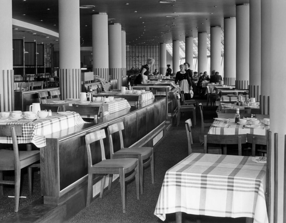 Airside, restaurant seating area overlooking apron, 1950s.