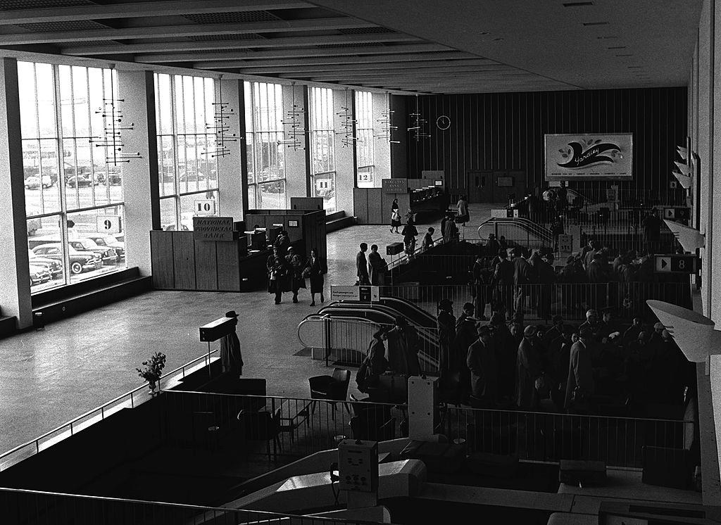 The Waiting pen for channel 7 where passengers queue ready to move through to customs, 1955.