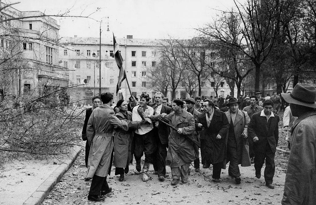 Member of the Hungarian secret police (AVH) surrounded by the enraged crowd during the revolt.  Budapest, November 1956