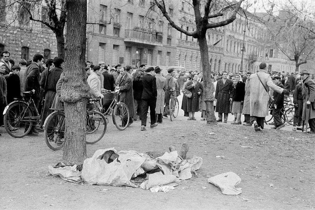 People gathered around a deceased body in Budapest, 1956