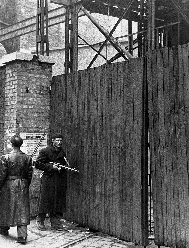 A worker keeps guard outside a striking factory during the 1956 anti communist revolution in Hungary.