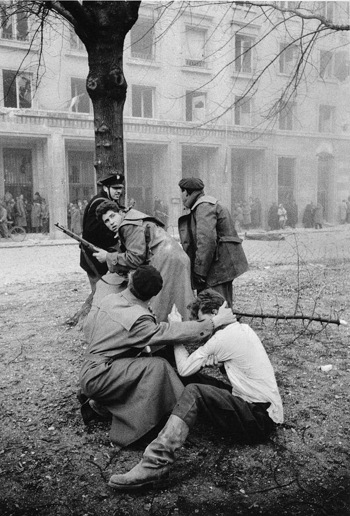 A member of the Hungarian secret police (AVH) has been captured by the enraged crowd during the revolt. Budapest, October 30, 1956