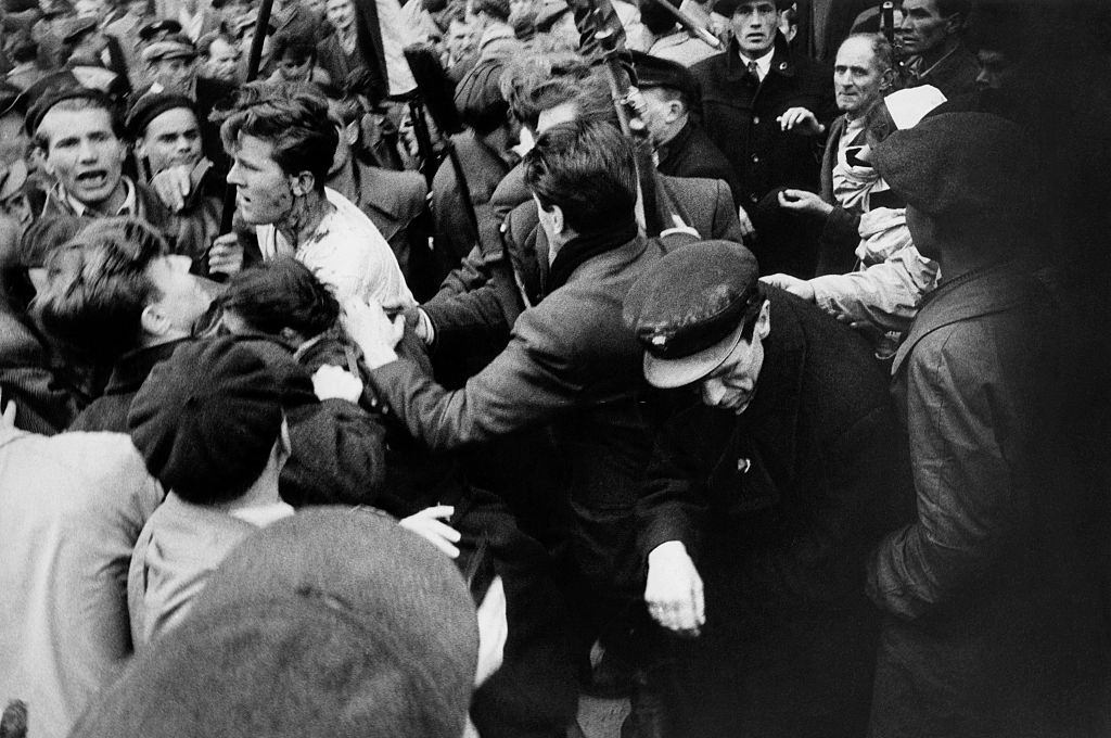 Member of the Hungarian secret police (AVH) surrounded by the enraged crowd during the revolt. Budapest, November 1956.