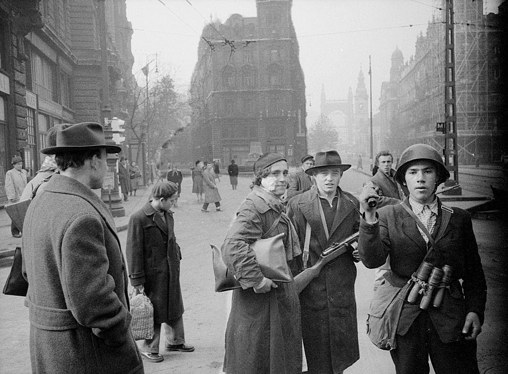 Two young revolutionaries in the streets of the city during the uprising against the Soviet regime.